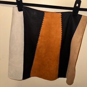 Blue Rain Black, Tan, and Cream color block faux suede mini skirt.